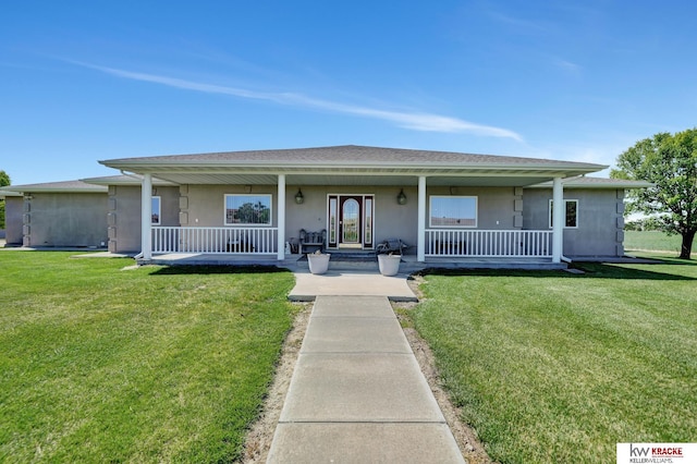 40798 US Highway 6, Cambridge, NE 69022 - view of front of home featuring covered porch, stucco siding, and a front yard