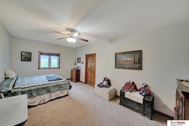 40798 US Highway 6, Cambridge, NE 69022 - carpeted bedroom with a ceiling fan, a textured ceiling, and baseboards