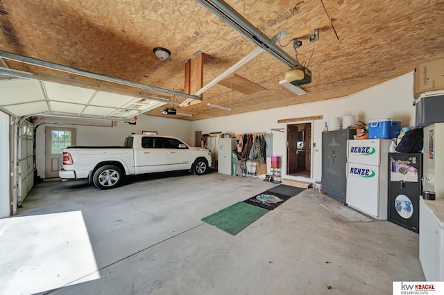 40798 US Highway 6, Cambridge, NE 69022 - garage with a garage door opener and freestanding refrigerator