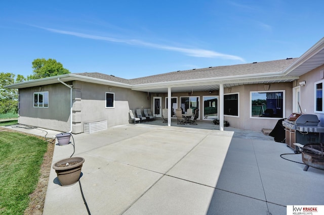 40798 US Highway 6, Cambridge, NE 69022 - rear view of house with stucco siding and a patio area