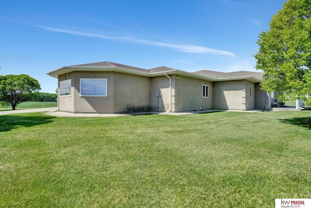 40798 US Highway 6, Cambridge, NE 69022 - view of side of property featuring stucco siding and a yard