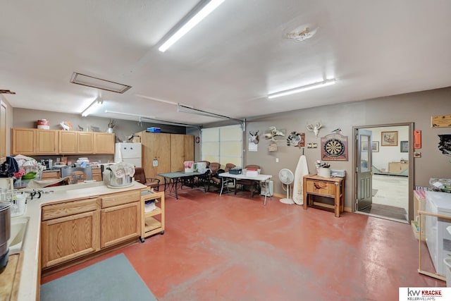 40798 US Highway 6, Cambridge, NE 69022 - kitchen featuring freestanding refrigerator, concrete flooring, light countertops, and light brown cabinets