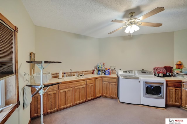 40798 US Highway 6, Cambridge, NE 69022 - laundry room with cabinet space, washing machine and dryer, light colored carpet, a ceiling fan, and a textured ceiling