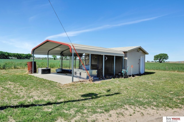 40798 US Highway 6, Cambridge, NE 69022 - back of house with a yard, a detached carport, and metal roof
