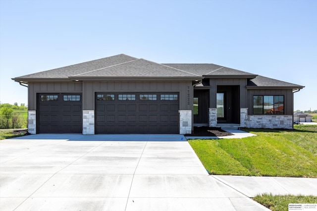 11019 N 166th St, Bennington, NE 68007 - prairie-style house featuring a garage, board and batten siding, a shingled roof, and stone siding