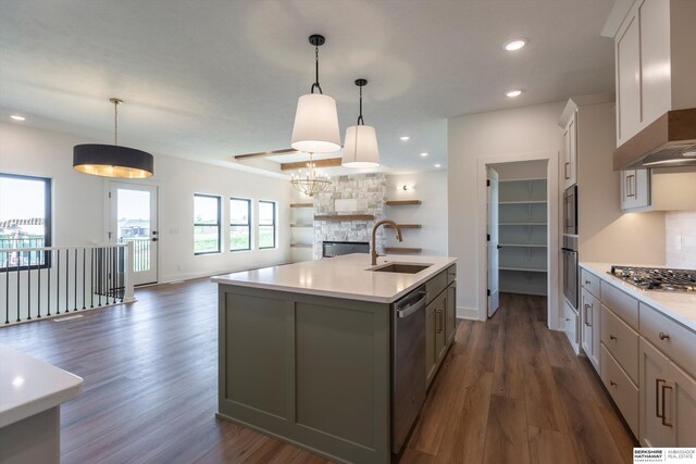 11019 N 166th St, Bennington, NE 68007 - kitchen featuring a sink, appliances with stainless steel finishes, open floor plan, wall chimney range hood, and light countertops