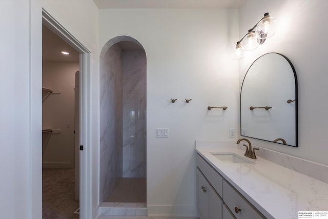 11019 N 166th St, Bennington, NE 68007 - full bath with vanity, a marble finish shower, a spacious closet, and baseboards