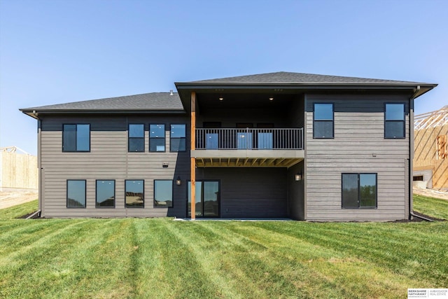 11019 N 166th St, Bennington, NE 68007 - back of property with a balcony, a yard, and roof with shingles