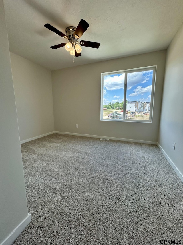 545 W Corsac Rd, Lincoln, NE 68523 - carpeted spare room featuring a ceiling fan and baseboards