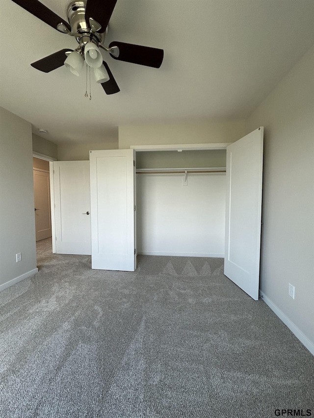 545 W Corsac Rd, Lincoln, NE 68523 - unfurnished bedroom with carpet flooring, baseboards, a closet, and a ceiling fan