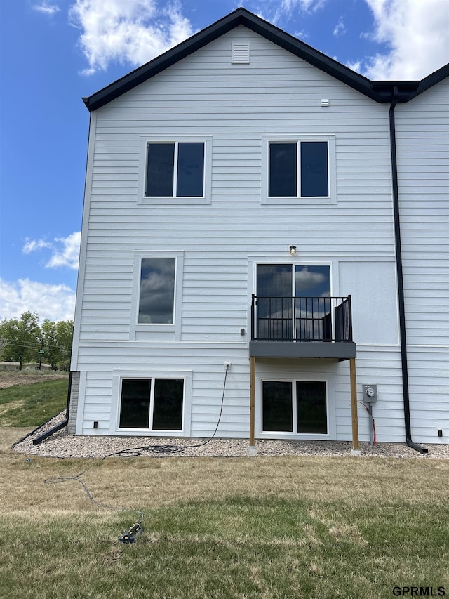 545 W Corsac Rd, Lincoln, NE 68523 - rear view of house with a yard and a balcony