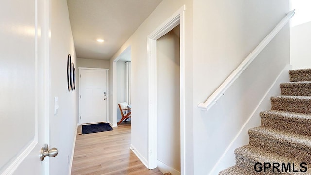 5412 N 188th St, Elkhorn, NE 68022 - stairway with wood finished floors, recessed lighting, and baseboards