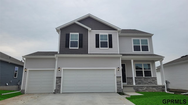 5412 N 188th St, Elkhorn, NE 68022 - view of front of property featuring covered porch, driveway, stone siding, and a garage
