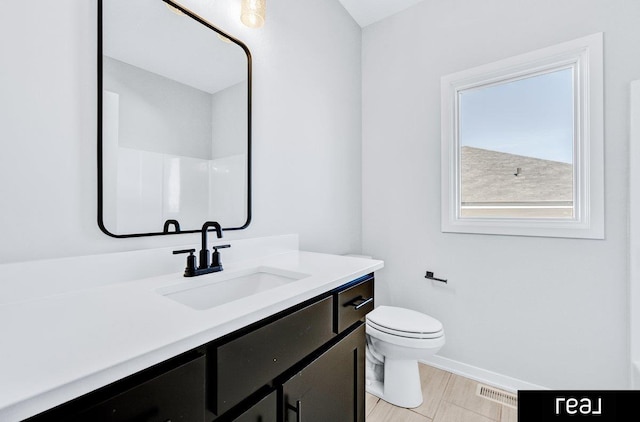 12003 S 109th St, Papillion, NE 68046 - bathroom featuring vanity, toilet, and baseboards