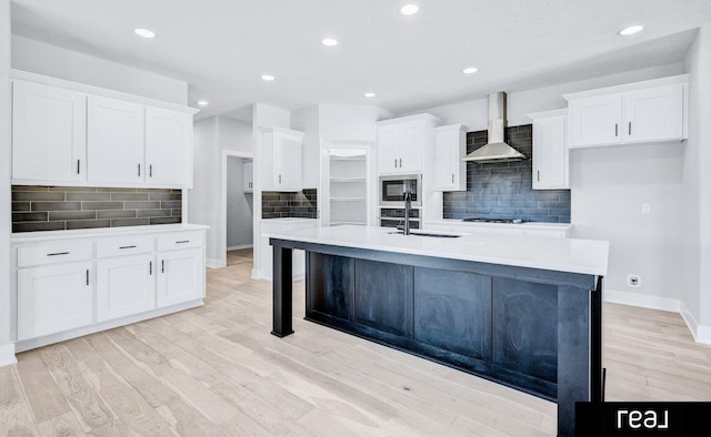 12003 S 109th St, Papillion, NE 68046 - kitchen featuring wall chimney range hood, stainless steel microwave, a sink, backsplash, and recessed lighting