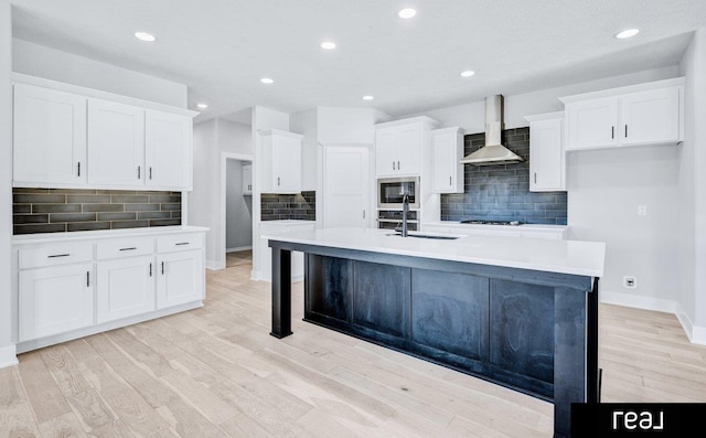12003 S 109th St, Papillion, NE 68046 - kitchen featuring wall chimney exhaust hood, stainless steel microwave, a sink, backsplash, and recessed lighting