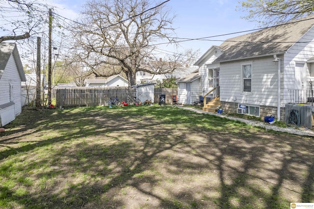 733 N H St, Fremont, NE 68025 - fenced backyard featuring entry steps