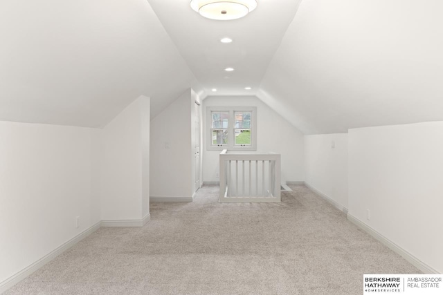 2035 N 50th St, Omaha, NE 68104 - bonus room with light colored carpet, lofted ceiling, baseboards, and recessed lighting