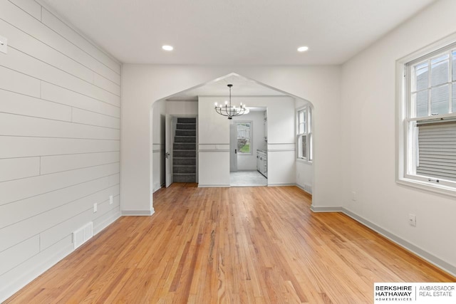 2035 N 50th St, Omaha, NE 68104 - unfurnished dining area featuring a chandelier, light wood-type flooring, baseboards, stairs, and recessed lighting