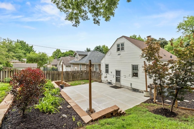 2035 N 50th St, Omaha, NE 68104 - rear view of property with a patio area and roof with shingles
