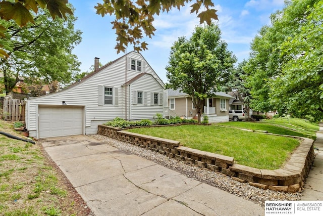 2035 N 50th St, Omaha, NE 68104 - view of side of home with concrete driveway, a chimney, and an attached garage