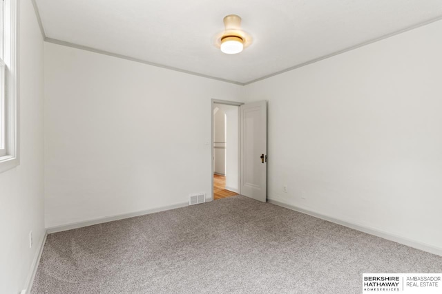 2035 N 50th St, Omaha, NE 68104 - spare room featuring carpet floors and baseboards
