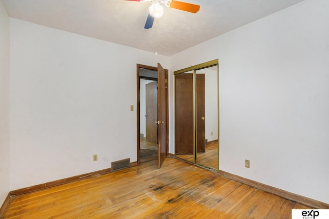 813 Janes View St, Papillion, NE 68046 - unfurnished bedroom with light wood-style flooring, baseboards, a closet, and a ceiling fan