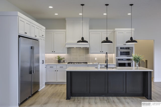 5717 S 200th Cir, Omaha, NE 68135 - kitchen featuring stainless steel appliances, a sink, white cabinets, and recessed lighting