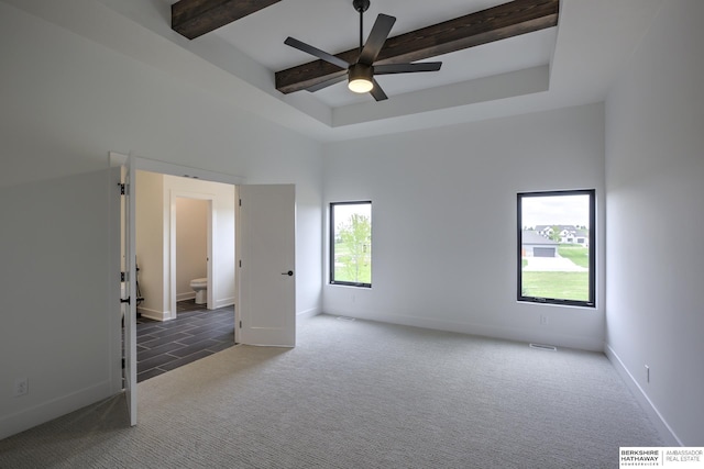 5717 S 200th Cir, Omaha, NE 68135 - tiled spare room with carpet floors, ceiling fan, a tray ceiling, beam ceiling, and baseboards