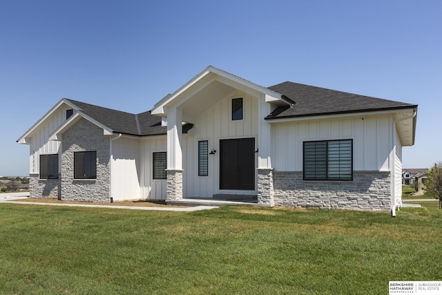 5717 S 200th Cir, Omaha, NE 68135 - modern inspired farmhouse with board and batten siding, stone siding, roof with shingles, and a front lawn