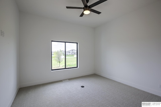 5717 S 200th Cir, Omaha, NE 68135 - spare room featuring carpet floors, a ceiling fan, and baseboards