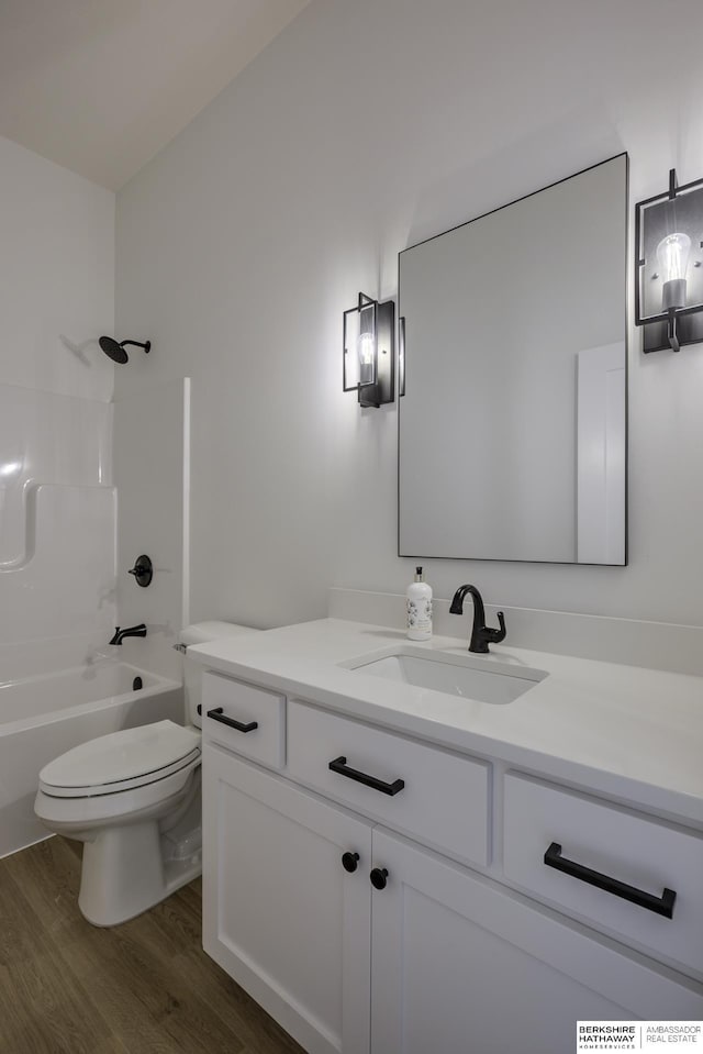 5717 S 200th Cir, Omaha, NE 68135 - full bath featuring wood finished floors, vanity, toilet, and shower / bath combination