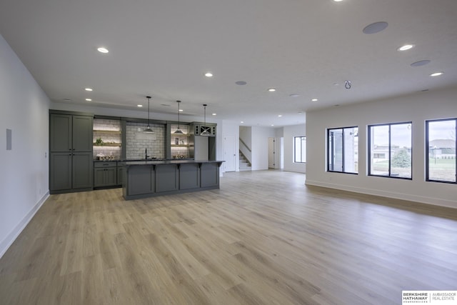 5717 S 200th Cir, Omaha, NE 68135 - kitchen with gray cabinetry, open floor plan, recessed lighting, baseboards, and light wood-style flooring