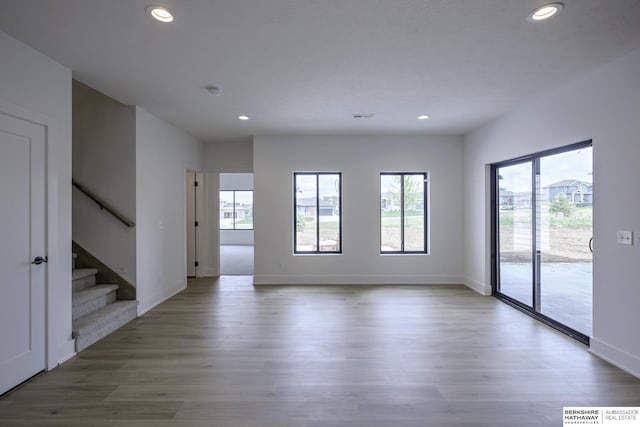 5717 S 200th Cir, Omaha, NE 68135 - unfurnished room featuring stairs, recessed lighting, wood finished floors, and baseboards