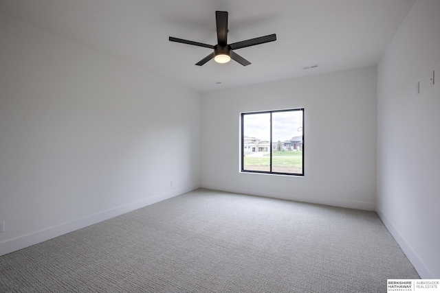 5717 S 200th Cir, Omaha, NE 68135 - spare room featuring light colored carpet, ceiling fan, and baseboards
