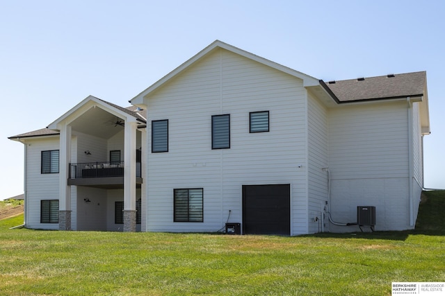 5717 S 200th Cir, Omaha, NE 68135 - back of house featuring a yard, central air condition unit, a balcony, a garage, and a ceiling fan