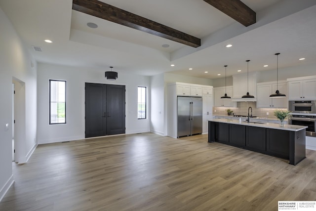 5717 S 200th Cir, Omaha, NE 68135 - kitchen featuring stainless steel appliances, light countertops, white cabinetry, baseboards, and recessed lighting