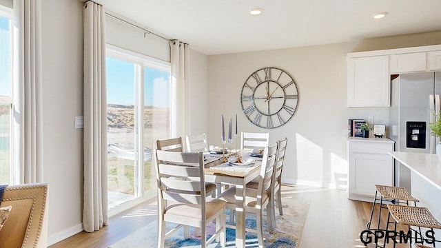 5415 N 188th St, Elkhorn, NE 68022 - dining space with light wood-style floors, baseboards, and recessed lighting