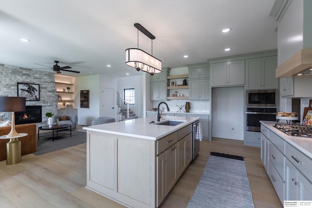 6617 S 214th St, Omaha, NE 68022 - kitchen featuring a sink, stainless steel appliances, premium range hood, gray cabinetry, and recessed lighting