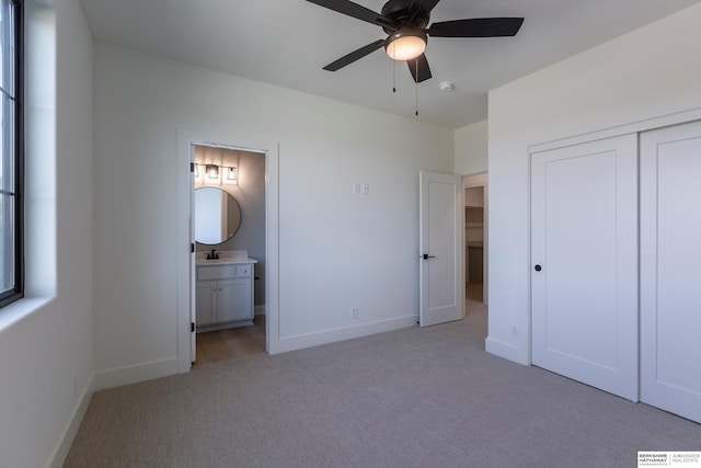 6617 S 214th St, Omaha, NE 68022 - unfurnished bedroom featuring light colored carpet, baseboards, connected bathroom, and a closet