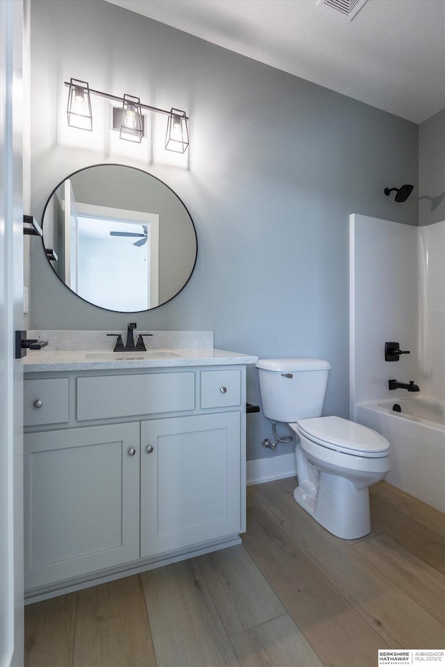 6617 S 214th St, Omaha, NE 68022 - full bath with wood finished floors, toilet, vanity,  shower combination, and baseboards