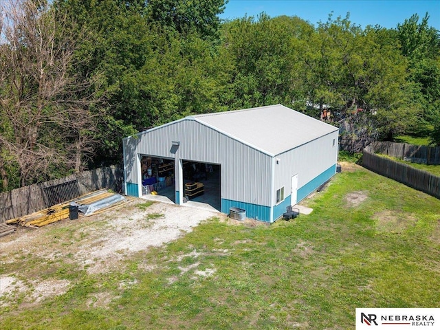 210 4th St, Ithaca, NE 68033 - view of pole building featuring driveway and a wooded view