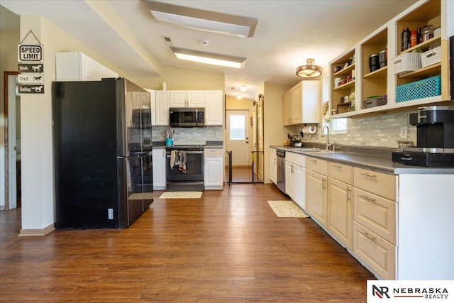 210 4th St, Ithaca, NE 68033 - kitchen with appliances with stainless steel finishes, a sink, backsplash, dark wood finished floors, and white cabinets