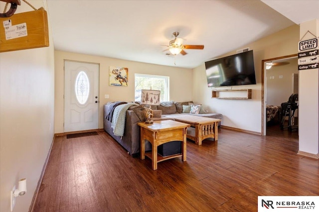 210 4th St, Ithaca, NE 68033 - living area featuring a ceiling fan, wood finished floors, and baseboards