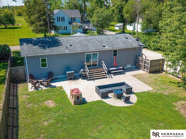 210 4th St, Ithaca, NE 68033 - back of property with an outdoor fire pit, a patio, and central AC unit
