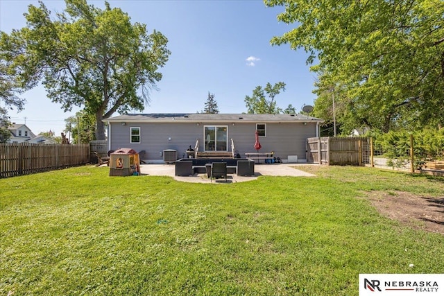 210 4th St, Ithaca, NE 68033 - back of property with a patio area and central AC