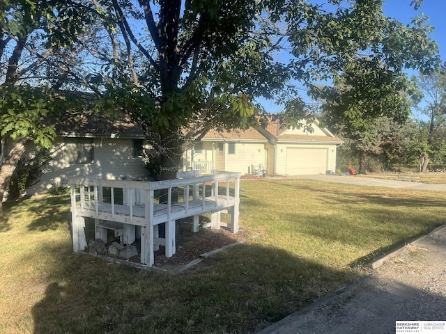 15911 S 234th St, Gretna, NE 68028 - view of side of property featuring a garage, a yard, and concrete driveway