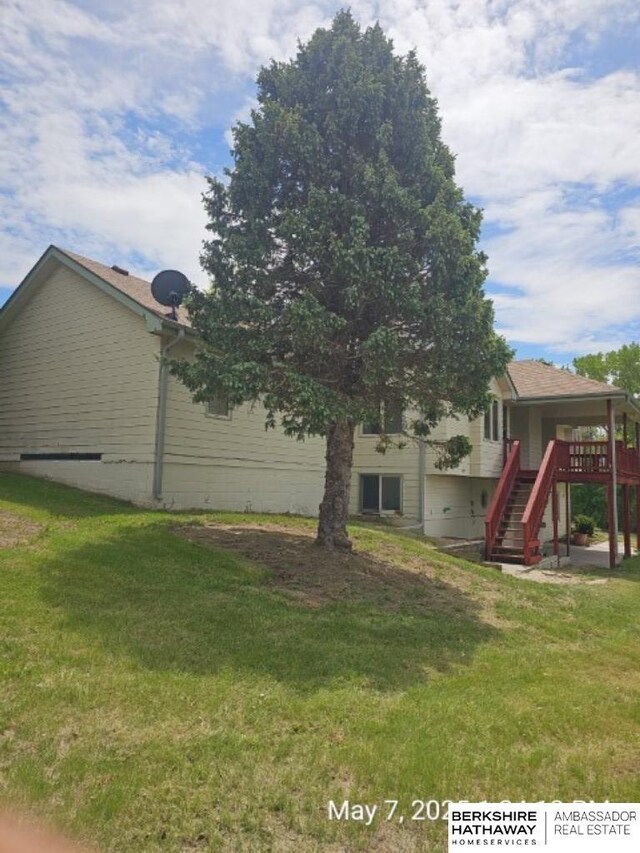 15911 S 234th St, Gretna, NE 68028 - view of green lawn with stairway and a deck