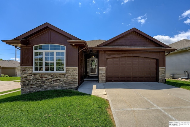 18855 Mason Plz, Omaha, NE 68022 - single story home with stone siding, an attached garage, concrete driveway, and a front yard
