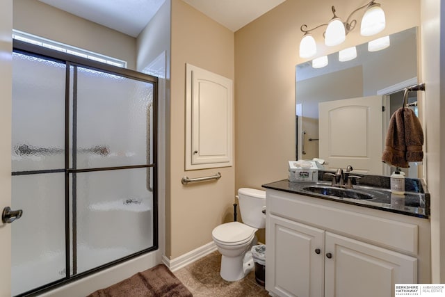 18855 Mason Plz, Omaha, NE 68022 - bathroom with a shower stall, toilet, vanity, baseboards, and tile patterned flooring